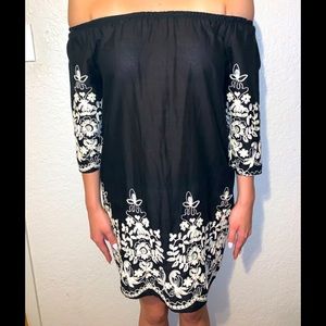 Black dress with white embroidery